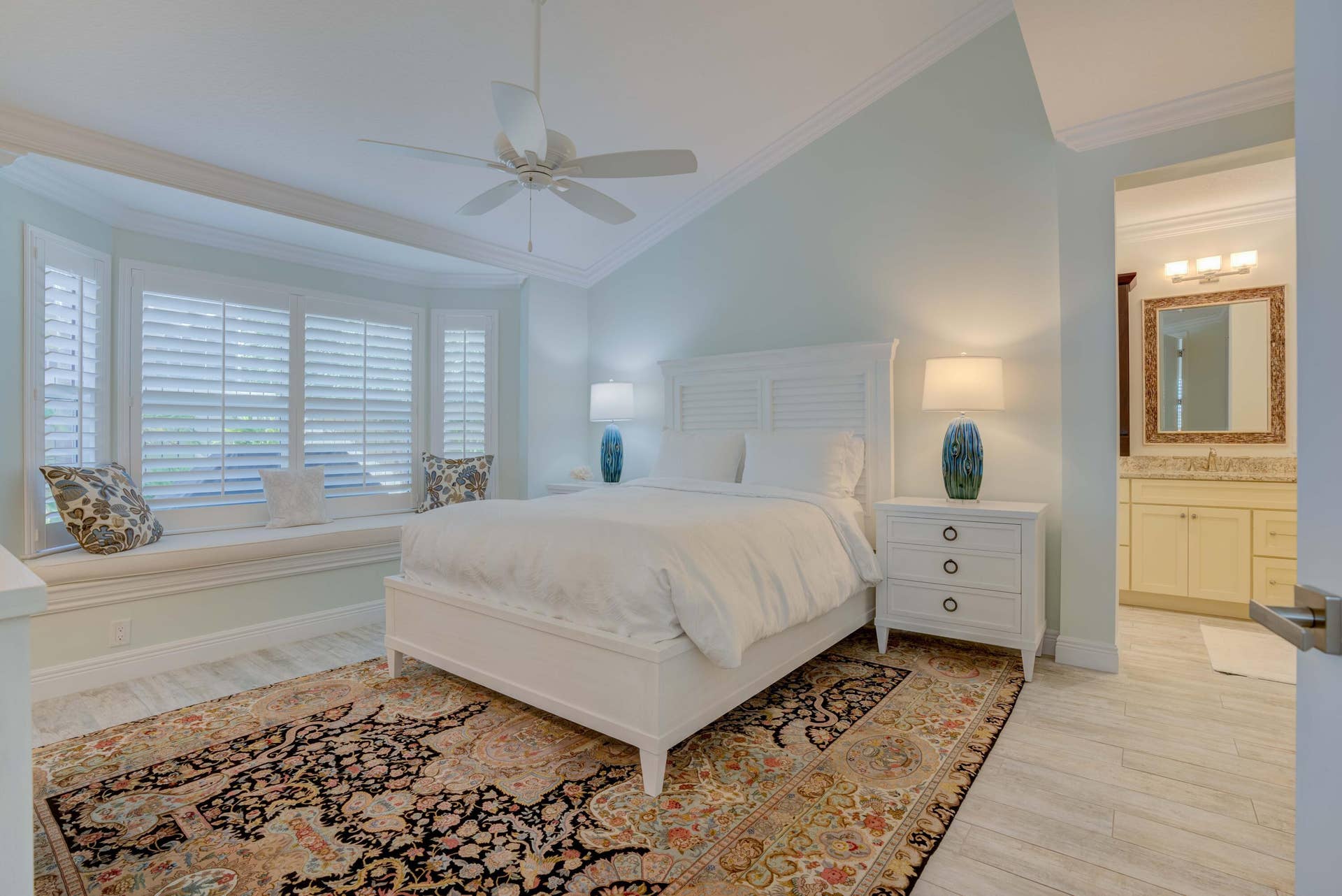 2043 Staysail Lane, Jupiter, Jupiter, FL 33477 Vaulted ceiling with ceiling fan, bay window with integrated bench seating, and wood-finish flooring