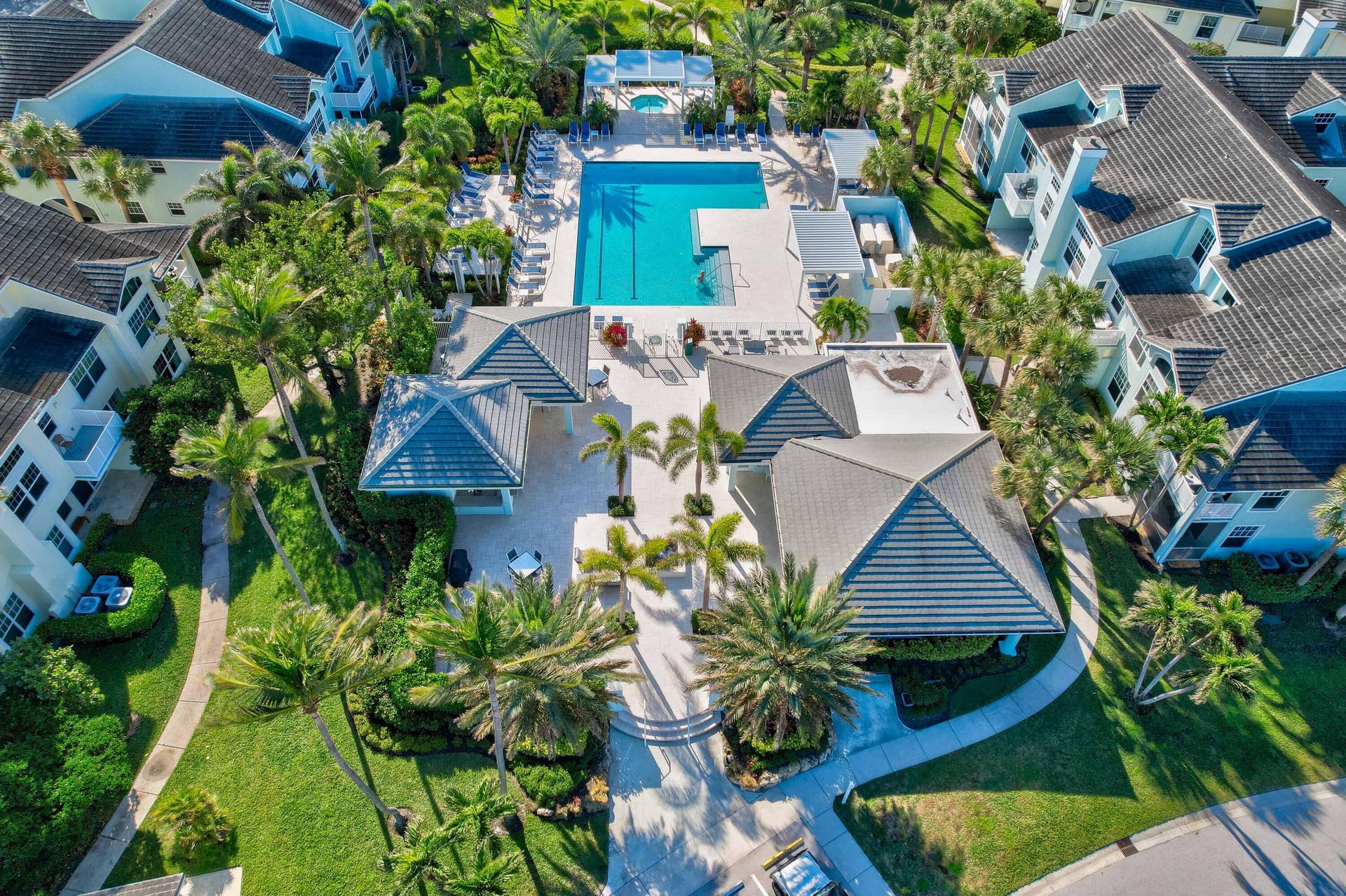 2043 Staysail Lane, Jupiter, Jupiter, FL 33477 Community features a rectangular swimming pool, multiple covered cabanas, and extensive landscaping