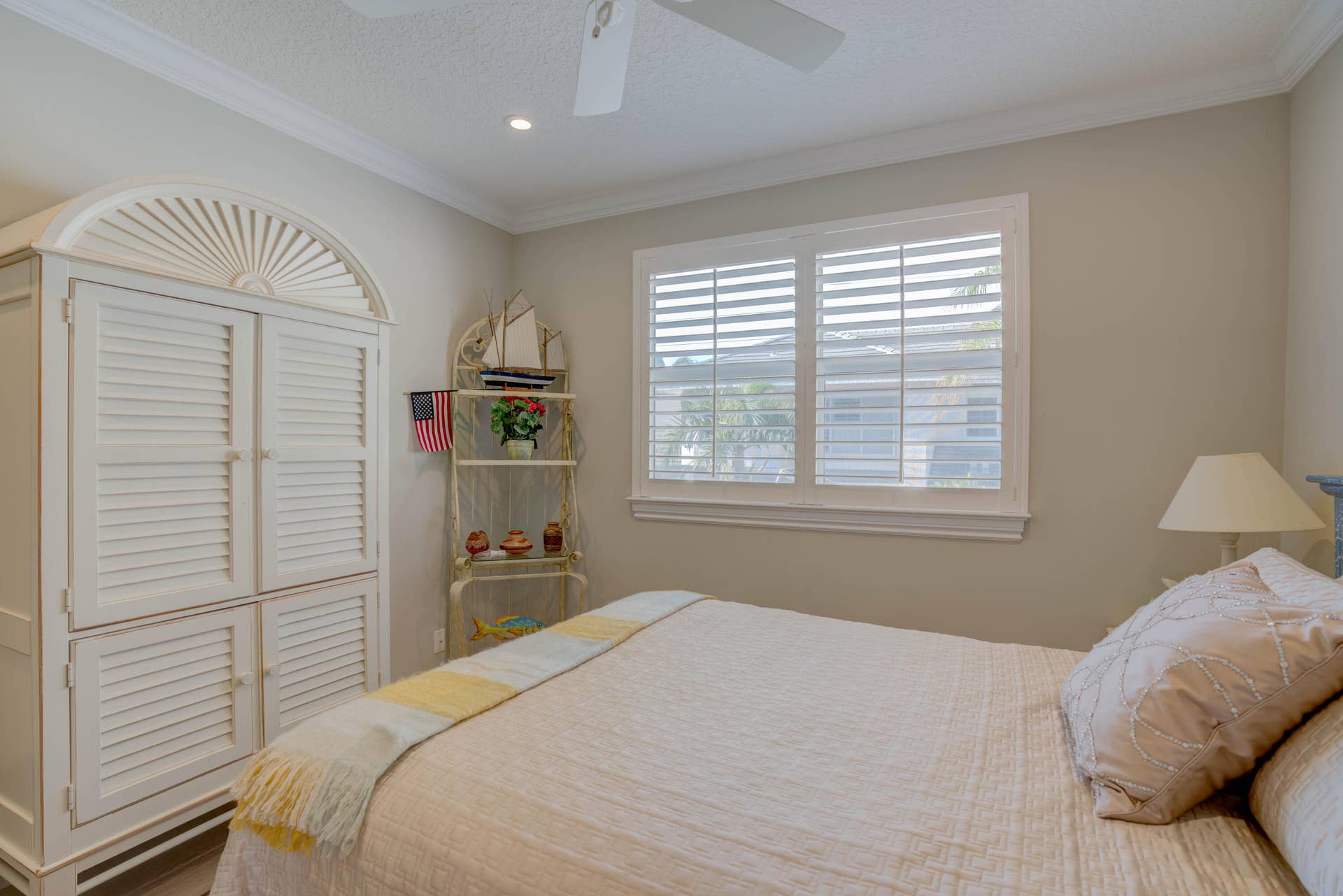 2043 Staysail Lane, Jupiter, Jupiter, FL 33477 White louvered window shutters, recessed lighting, and crown molding