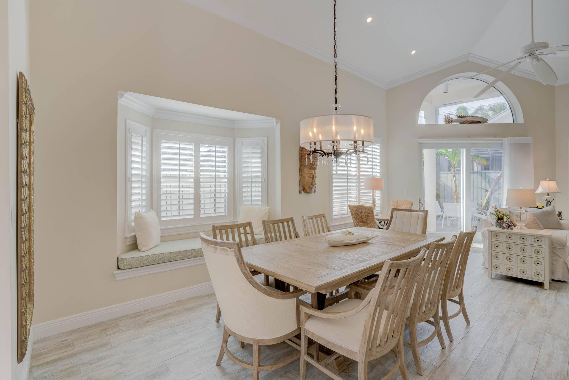 2043 Staysail Lane, Jupiter, Jupiter, FL 33477 Vaulted ceiling featuring recessed lighting, a bay window with plantation shutters, wood-finish flooring, and a sliding glass door