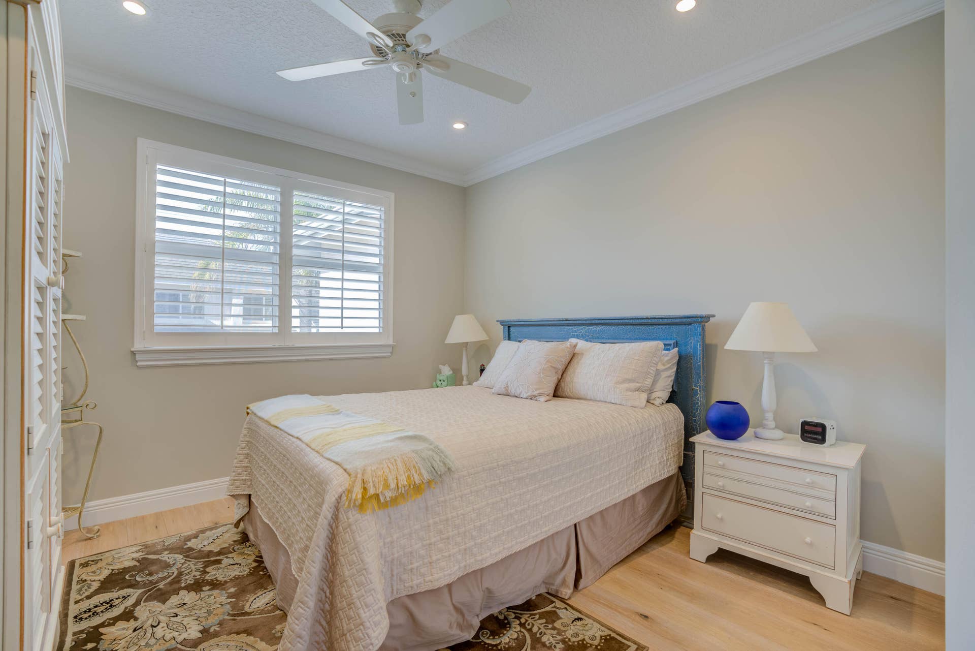 2043 Staysail Lane, Jupiter, Jupiter, FL 33477 Wood-finish flooring, recessed lighting, crown molding, ceiling fan, and window with plantation shutters