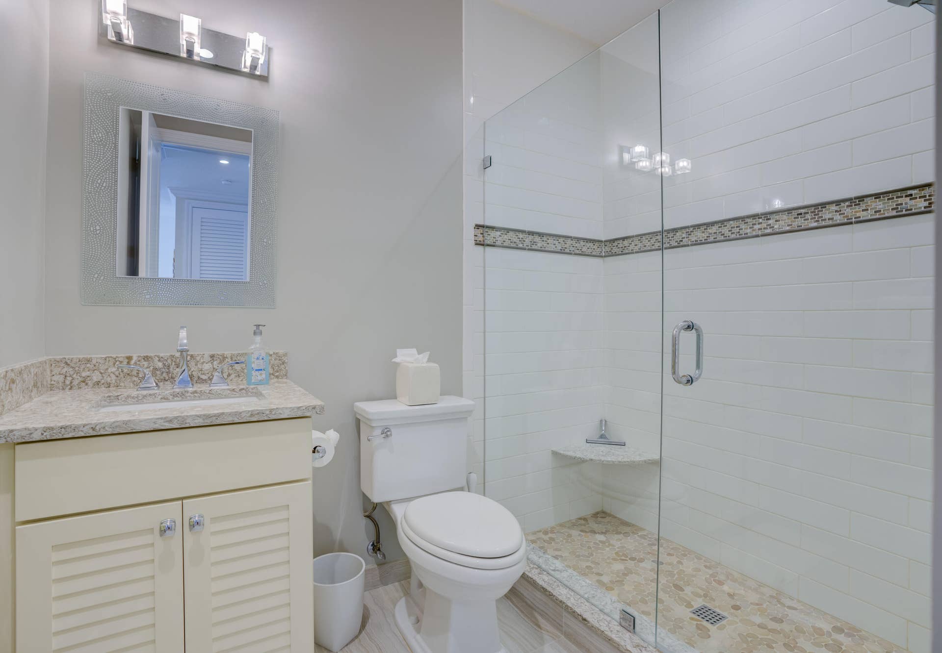 2043 Staysail Lane, Jupiter, Jupiter, FL 33477 Walk-in shower with glass enclosure, decorative accent tile, and built-in bench