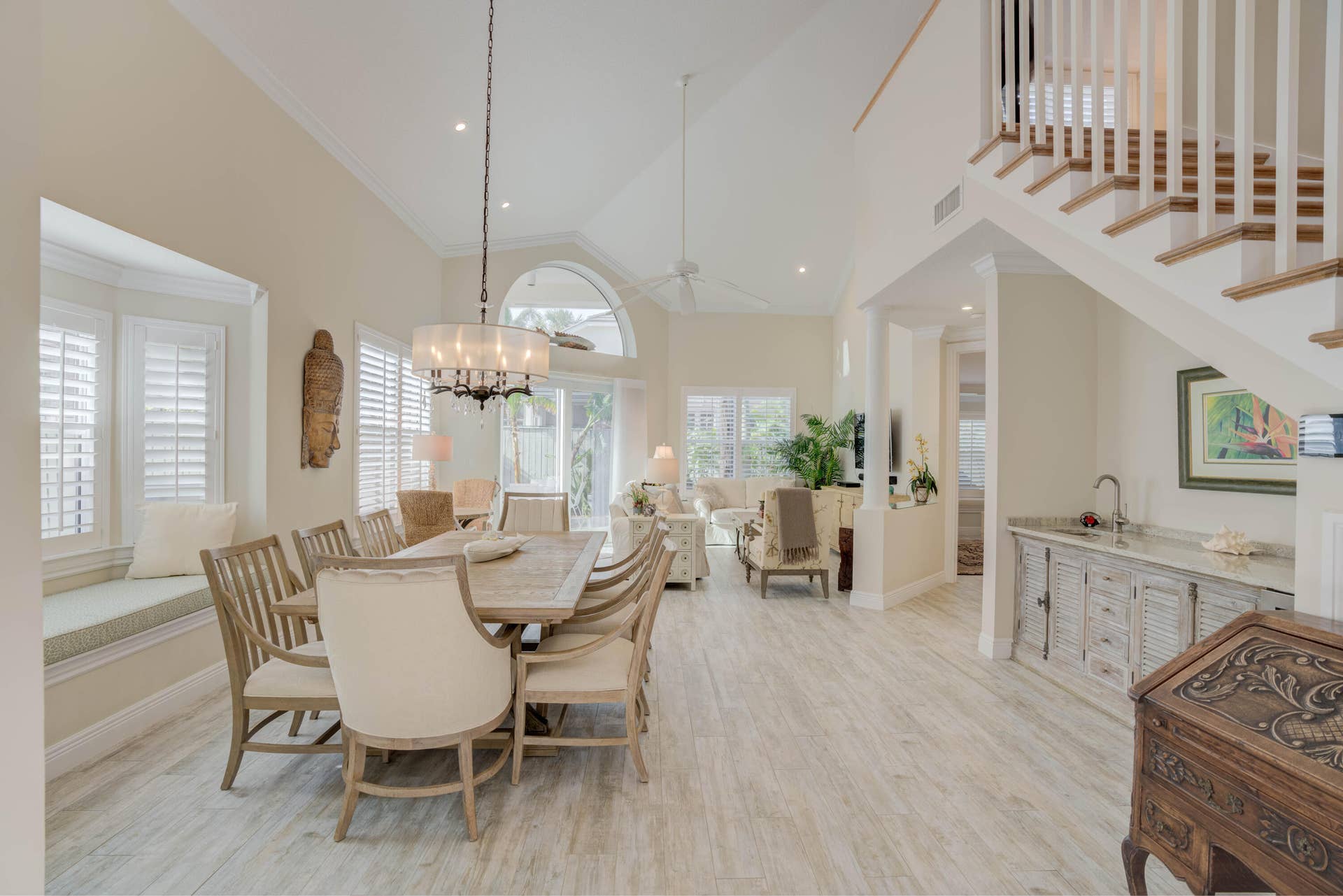2043 Staysail Lane, Jupiter, Jupiter, FL 33477 Vaulted ceilings, wood-finish flooring, built-in window seating, and a wet bar with a countertop sink