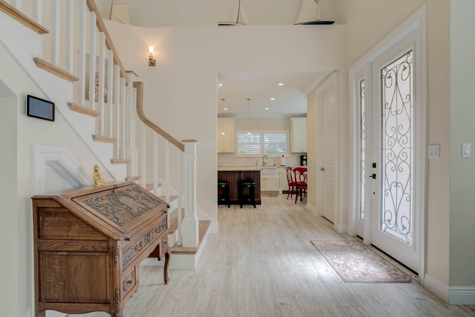 2043 Staysail Lane, Jupiter, Jupiter, FL 33477 White paneled entry door with decorative glass inserts and sidelight