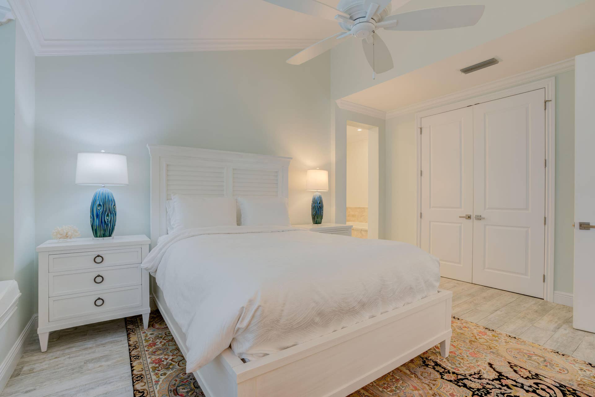 2043 Staysail Lane, Jupiter, Jupiter, FL 33477 Vaulted ceiling with crown molding, ceiling fan, double closet doors, and wood-finish flooring