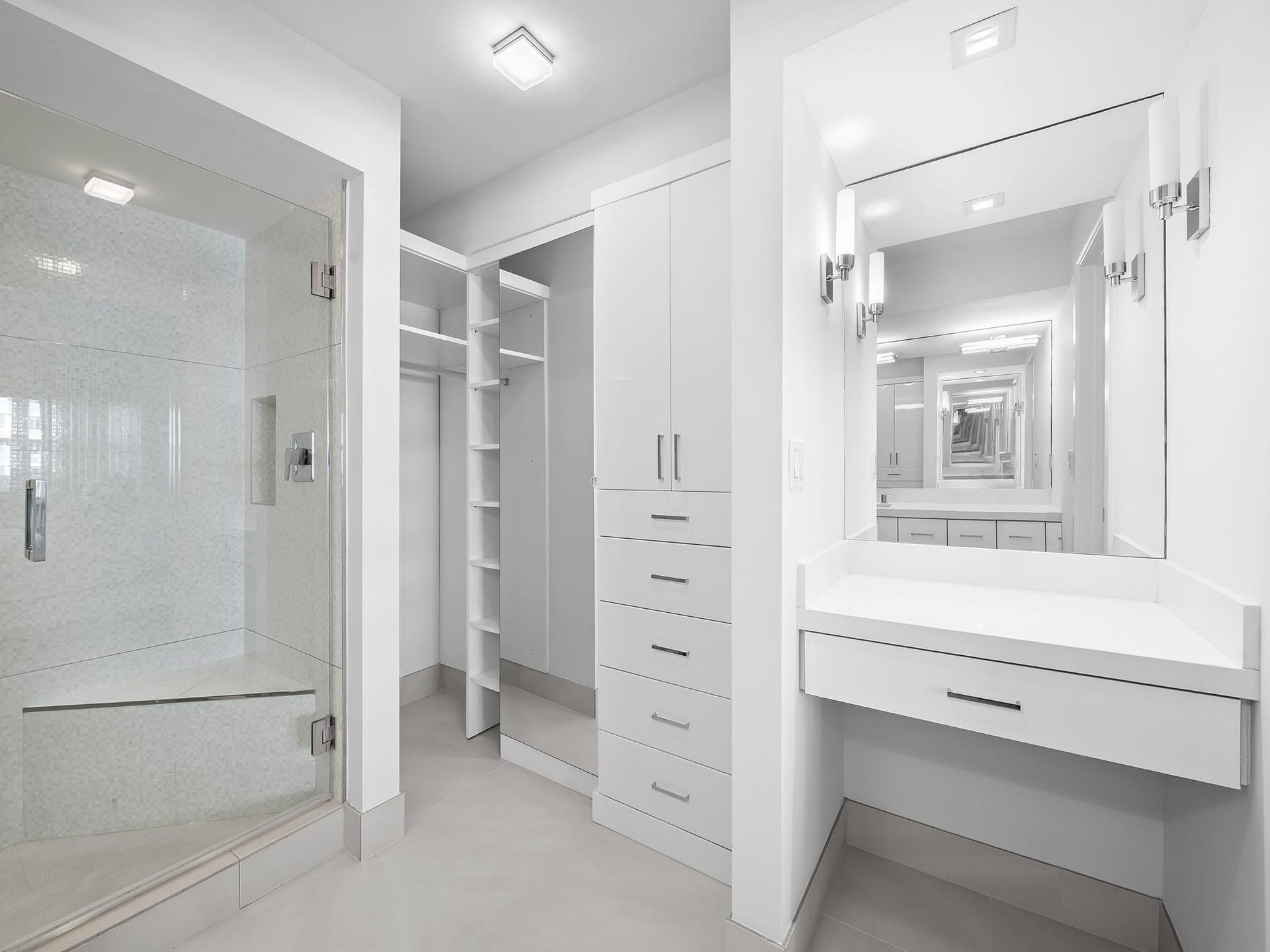 2000 S Ocean Drive, #709, Fort Lauderdale, FL 33316 A spacious bathroom flows into its own dressing room and features a sleek walk-in shower,
