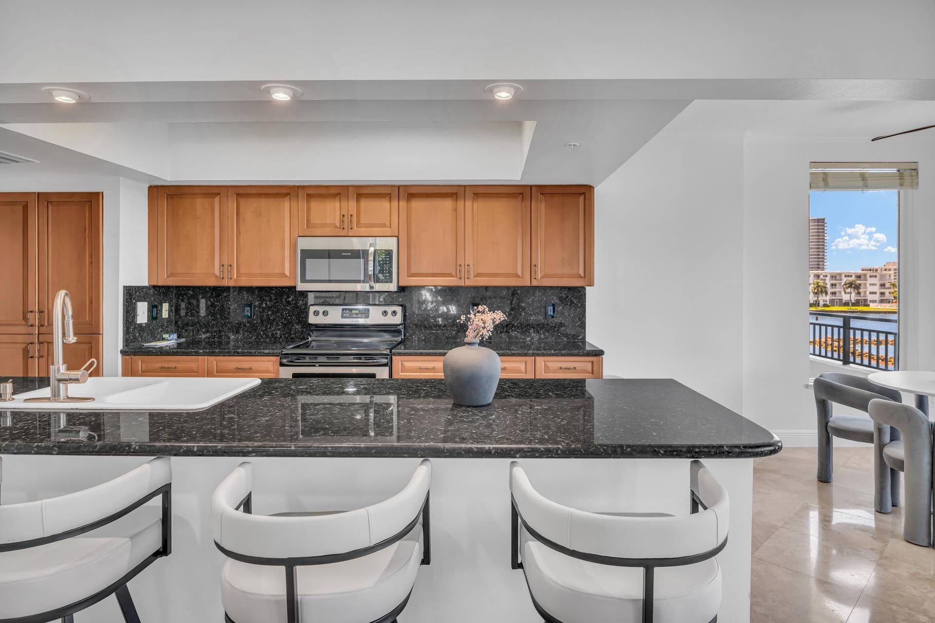 2880 NE 14TH ST Causeway, #213, Pompano Beach, FL 33062 Open kitchen with counter seating.
