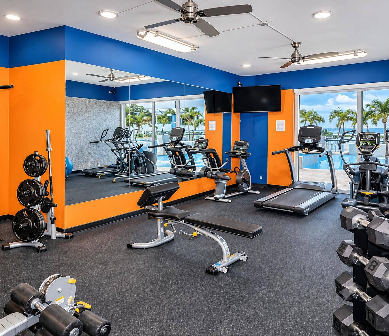 Vibrant Gym Overlooking Tropical Pool