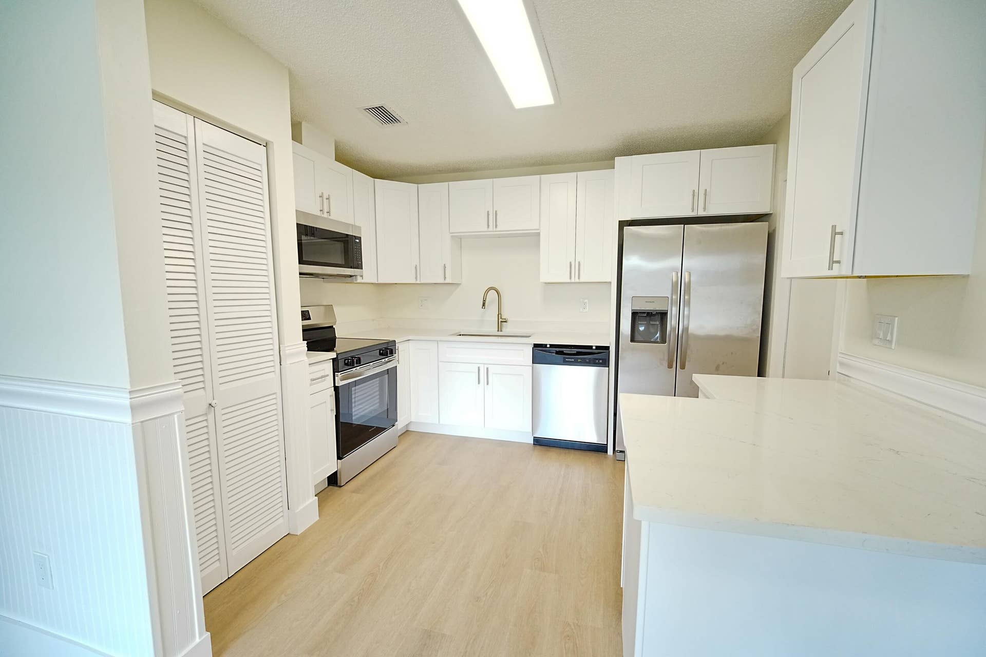 Wood cabinets with quartz counters