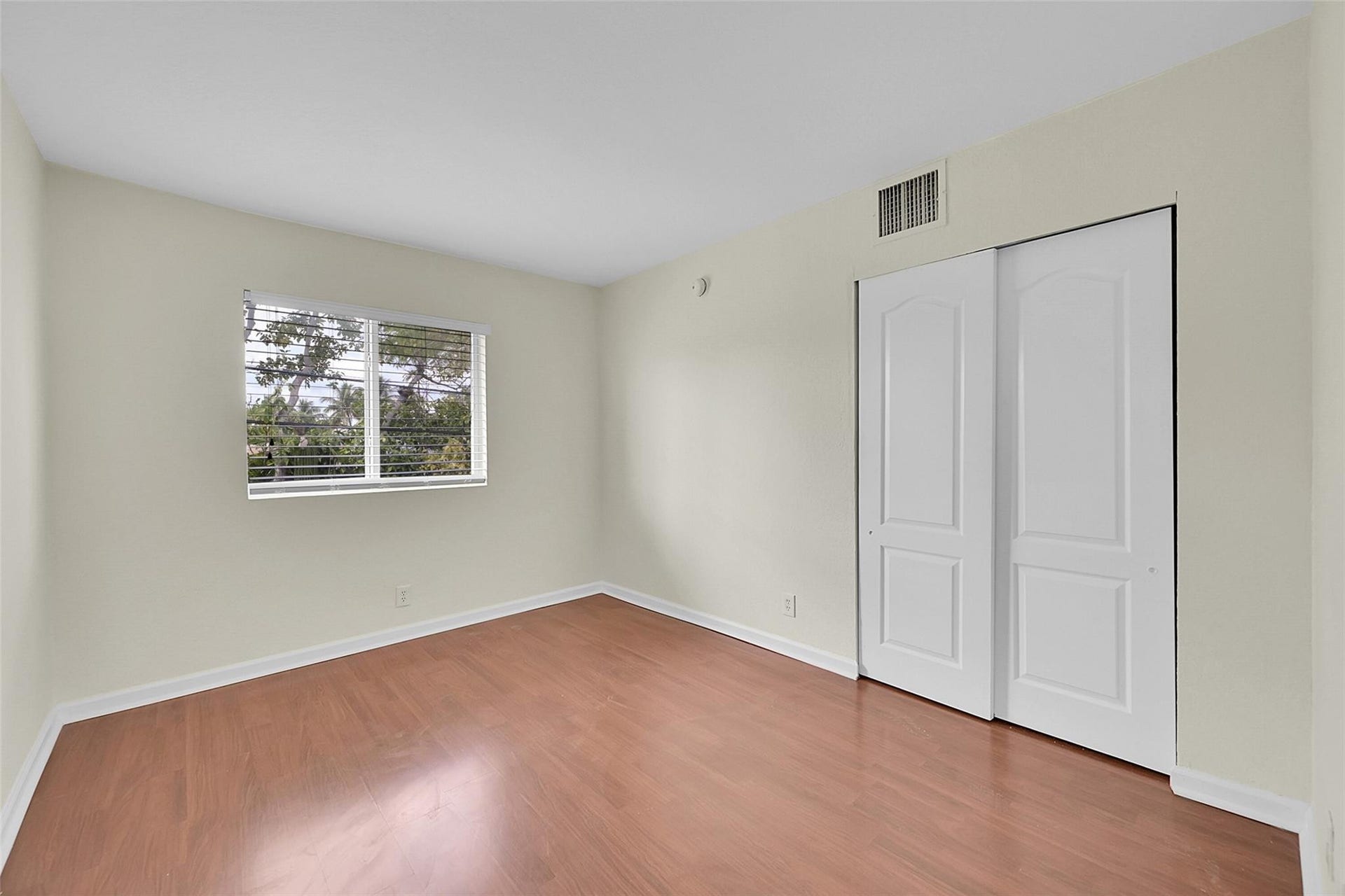 2655 NE 8th Avenue, #Apt 210, Wilton Manors, FL 33334 Wood-finish flooring with white baseboards and light-toned walls