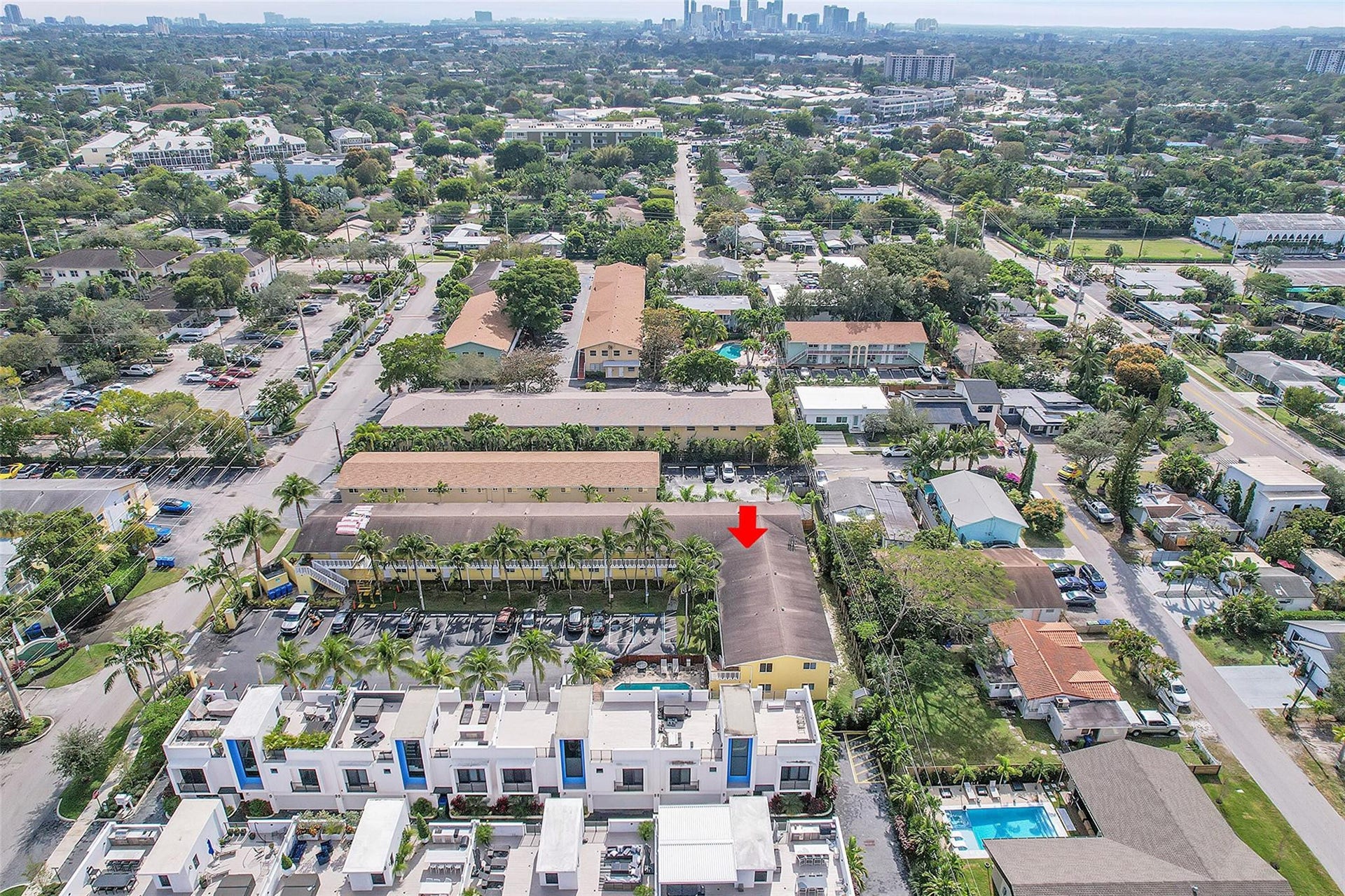 2655 NE 8th Avenue, #Apt 210, Wilton Manors, FL 33334 Aerial perspective showcasing surrounding properties and urban skyline