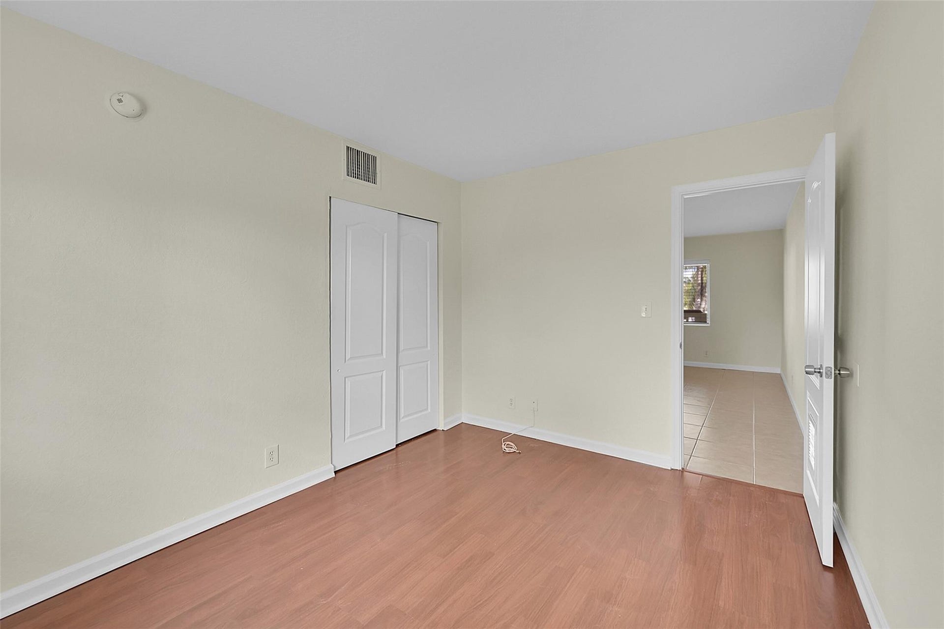 2655 NE 8th Avenue, #Apt 210, Wilton Manors, FL 33334 Wood-finish flooring, light-toned walls, and a white ceiling