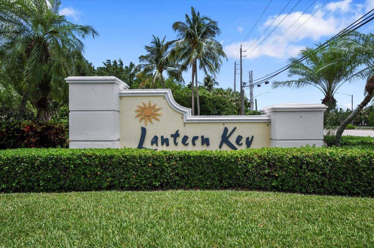 Welcoming entrance to the Lantern Key community featuring attractive tropical landscaping.