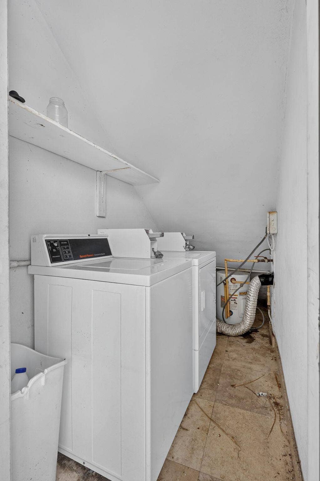 405 SOUTHWIND Drive, #3, North Palm Beach, FL 33408 Laundry alcove featuring white appliances and a wall-mounted storage shelf