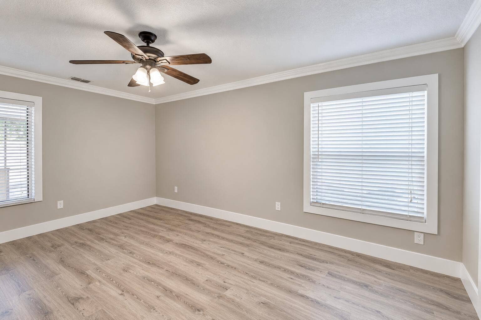 8379 Garden Gate Place, Boca Raton, FL 33433 Empty Neutral-Toned Room with Ceiling Fa