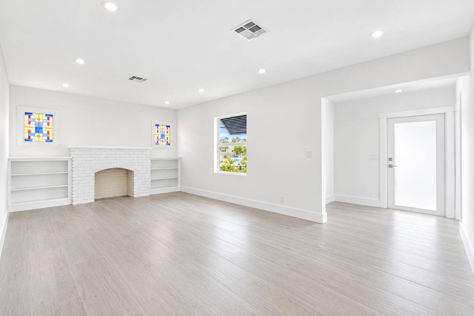 216 NE 23RD Avenue, Pompano Beach, FL 33062 Bright White Living Room with Stained Gl