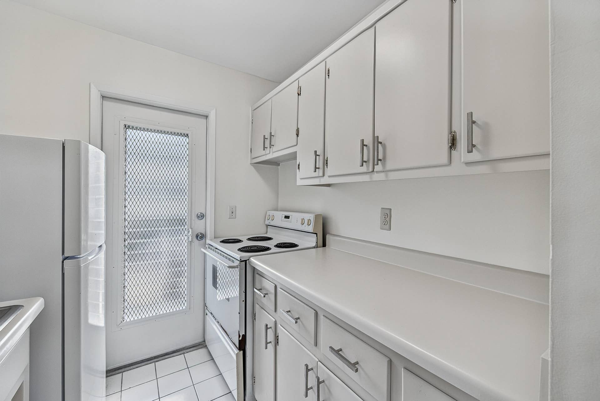 1430 Cordova Road, #24D, Fort Lauderdale, FL 33316 Back door in kitchen leads to another balcony area