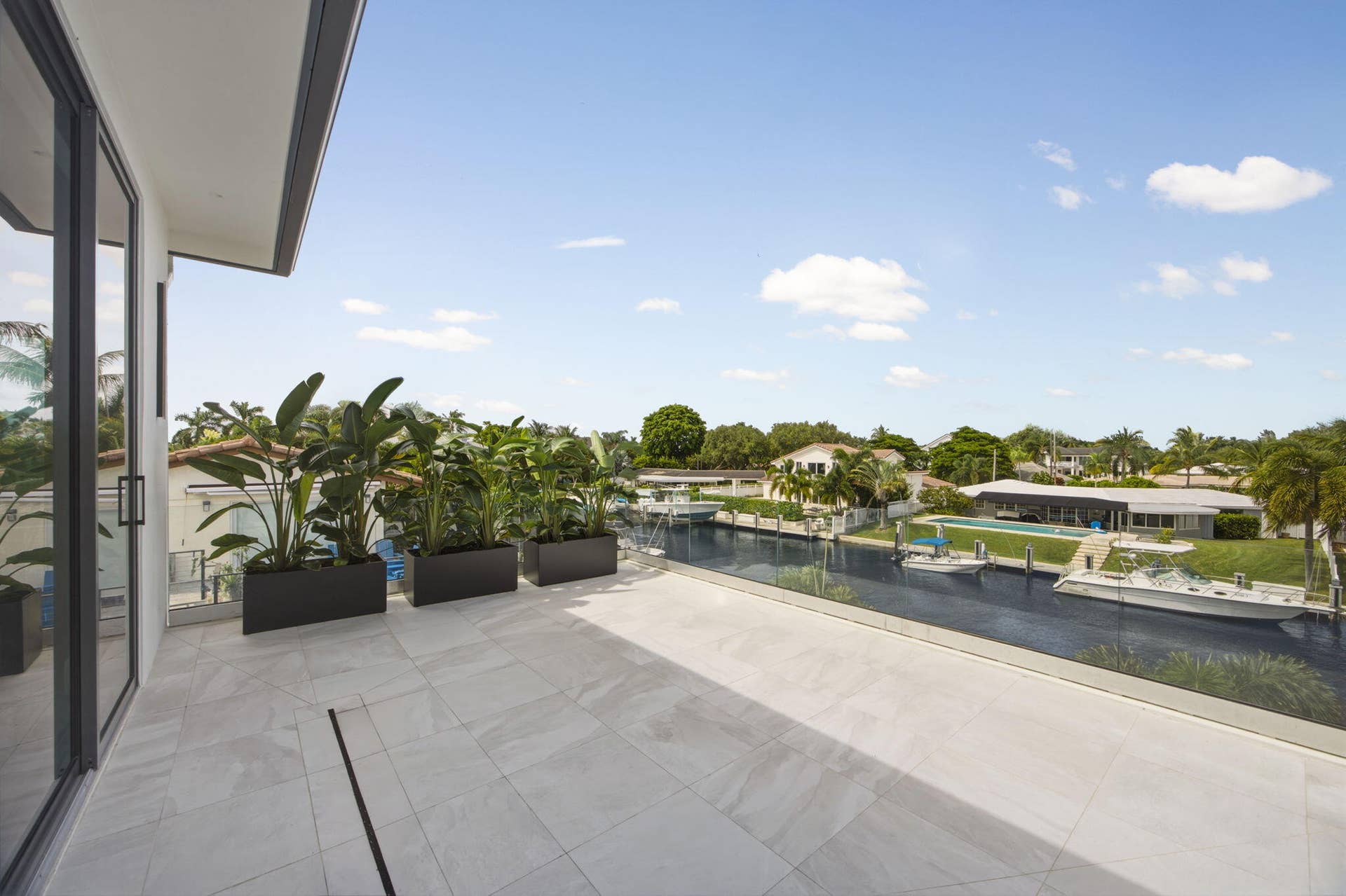 2921 NE 23RD Street, Pompano Beach, FL 33062 Primary Giant Private Balcony with impact glass railing