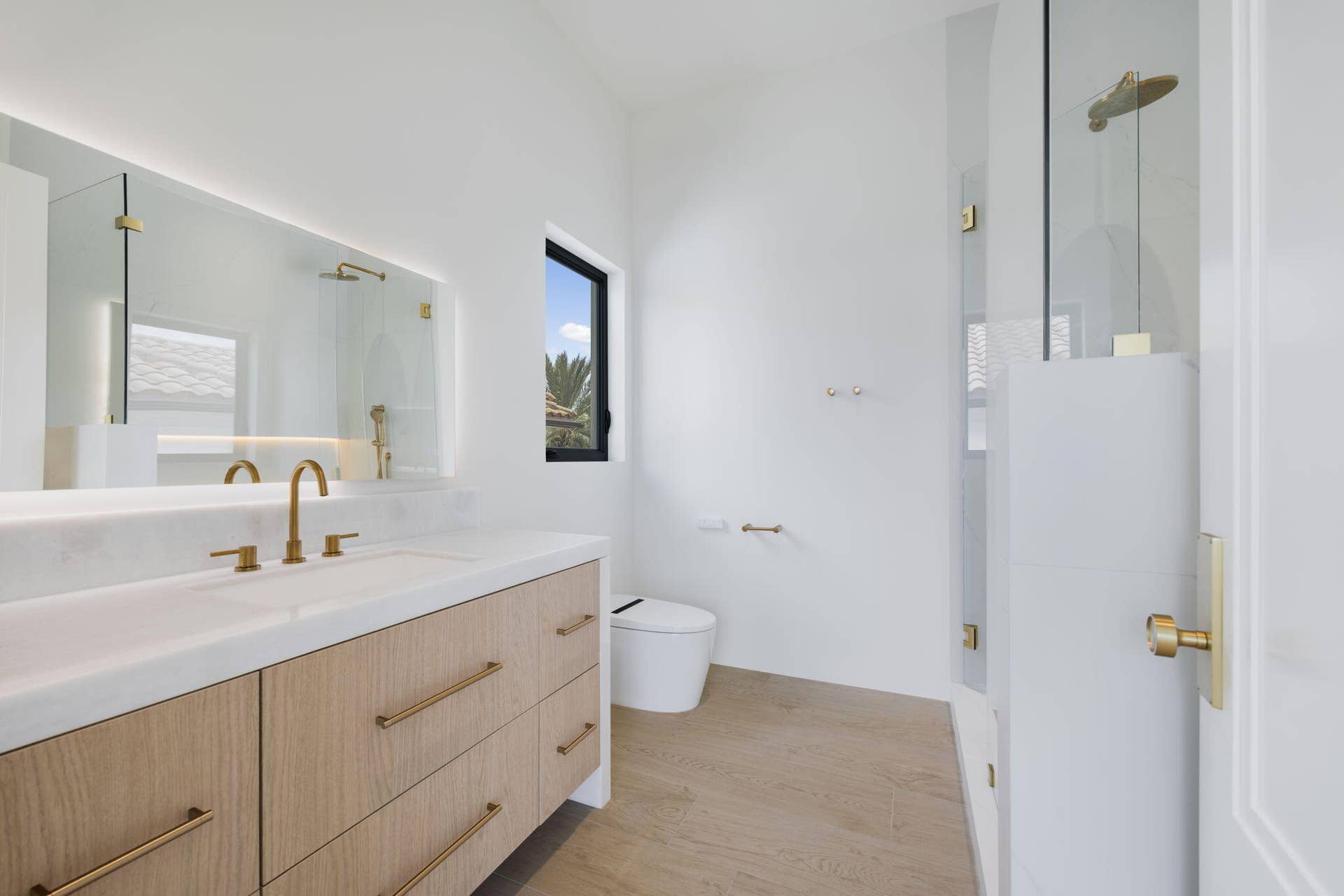 2921 NE 23RD Street, Pompano Beach, FL 33062 Bathroom 2 shower w/ 2 vanities and smart toilet and backlit led mirrors - 2nd floor