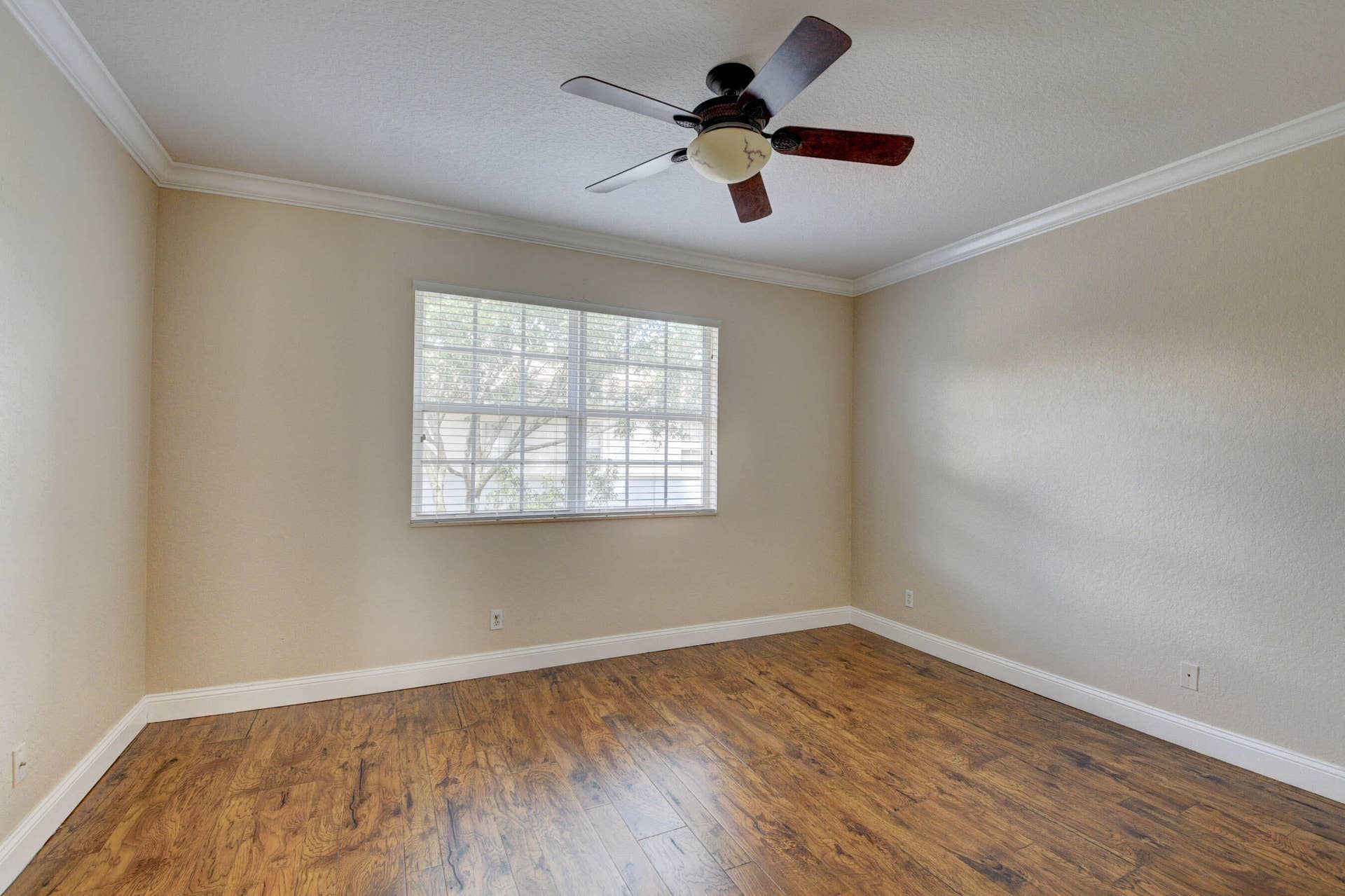 4353 Legacy Court, Delray Beach, FL 33445 Bedroom with ceiling fan and window.