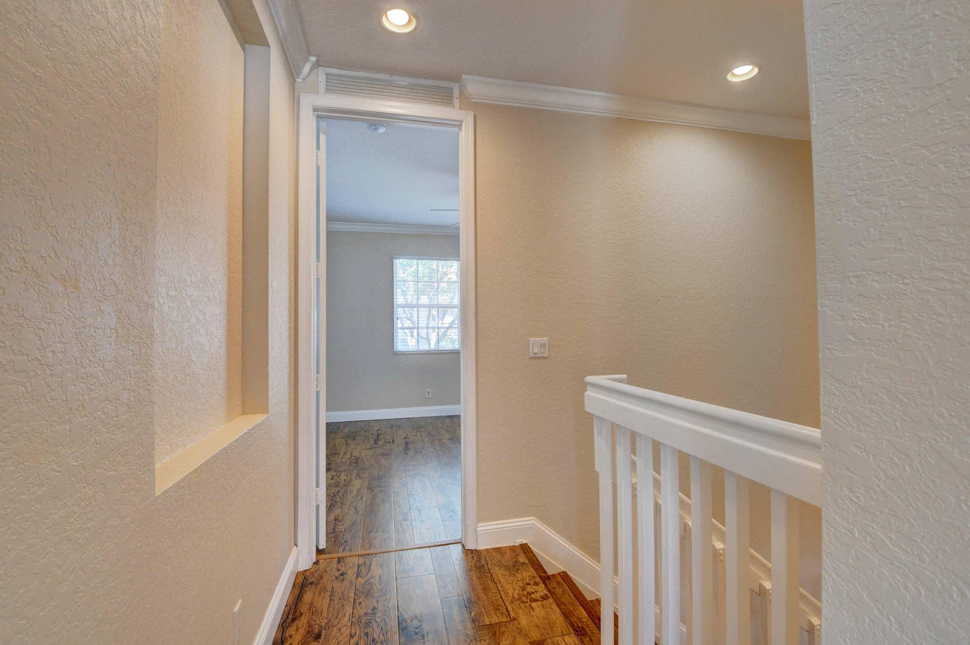 4353 Legacy Court, Delray Beach, FL 33445 Second-floor landing with railing and an open doorway.