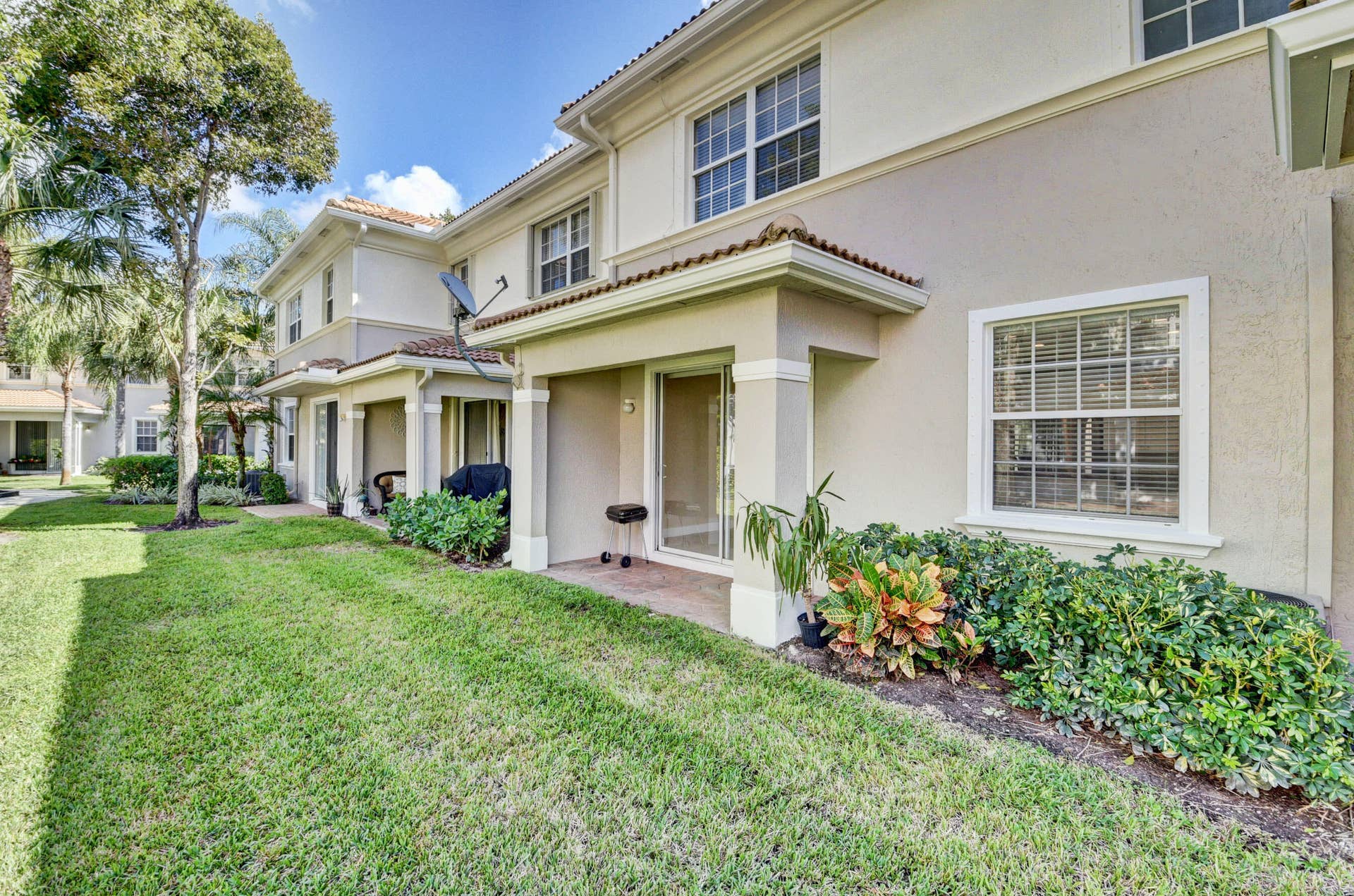 4353 Legacy Court, Delray Beach, FL 33445 Building exterior with covered entries and landscaped grounds.