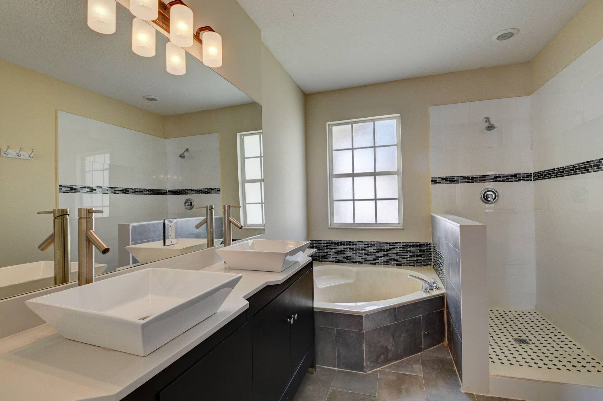 4353 Legacy Court, Delray Beach, FL 33445 Bathroom with soaking tub, glass-enclosed shower and vessel sink.