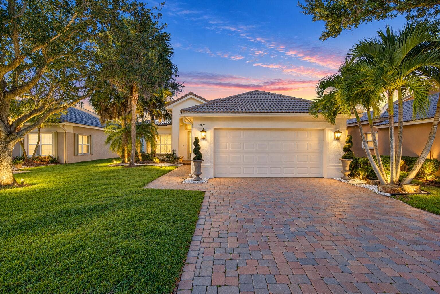 11289 NW 65TH Manor, Parkland, FL 33076 Twilight Mediterranean Home with Lush La