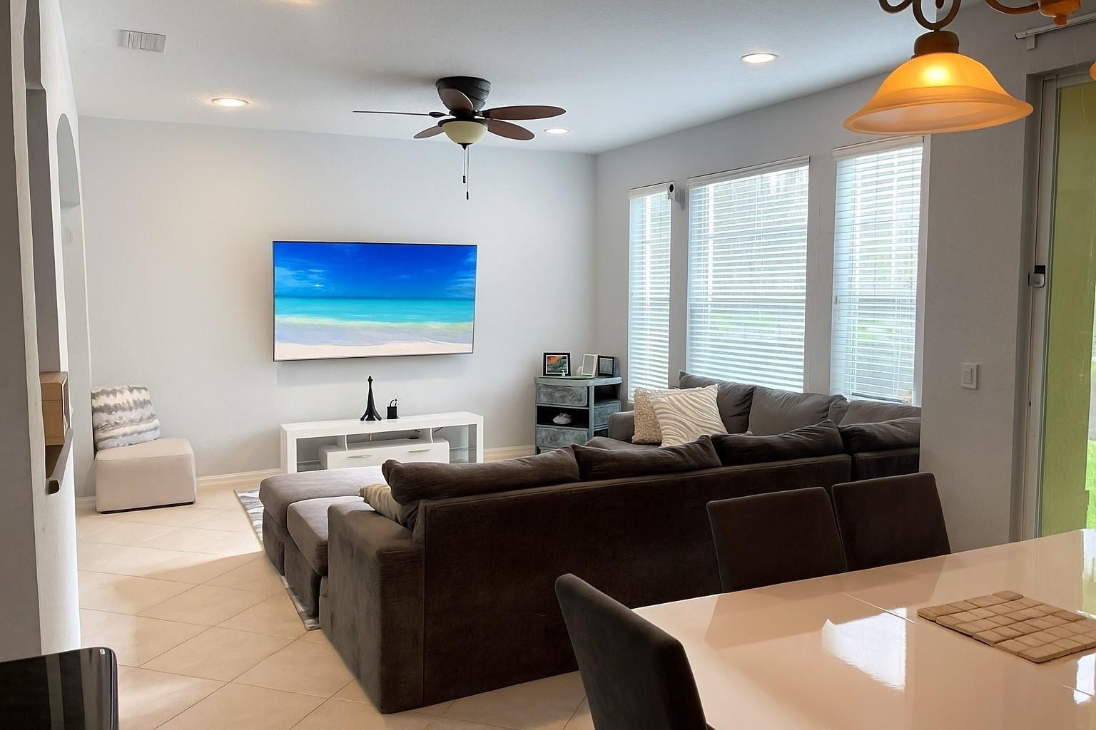 5780 NW 120TH Avenue, Coral Springs, Coral Springs, FL 33076 Living area featuring neutral tile flooring, recessed ceiling lighting, a multi-blade ceiling fan, and three large windows with horizontal blinds