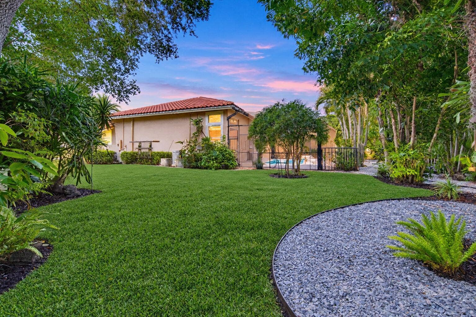1051 NW 121ST Terrace, Coral Springs, FL 33071 Twilight Backyard with Pool and Palms