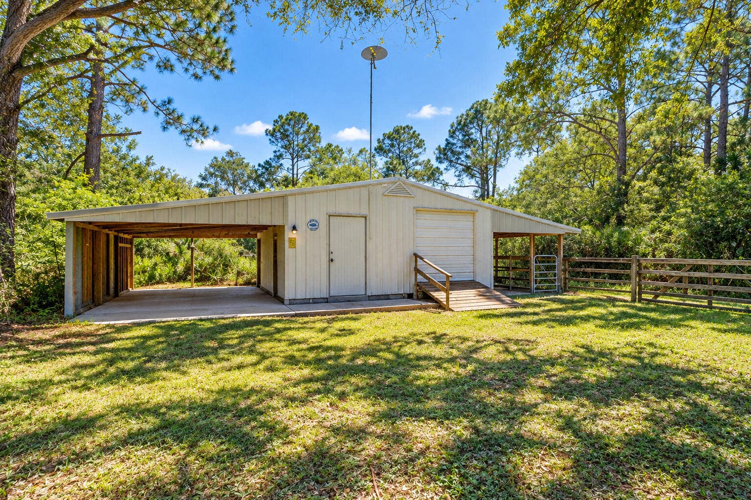 Metal Barn/Shed with covered equipment storage and animal stalls