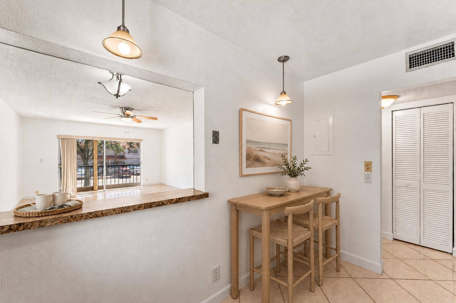 Coastal pass-through kitchen with oak ba