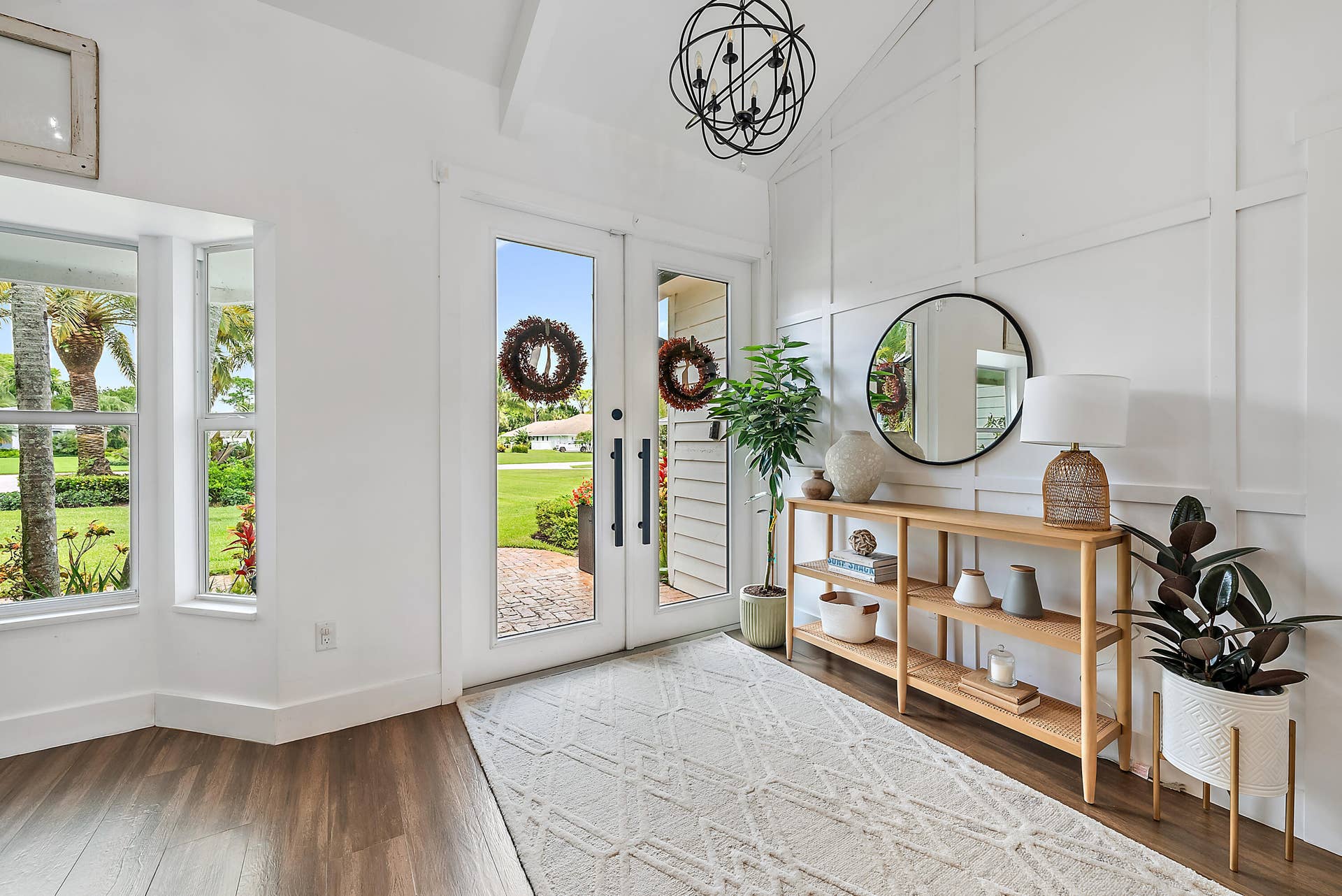 6204 SAND PINE Court, Jupiter, Jupiter, FL 33458 Wood-look tile flooring with a white board and batten accent wall