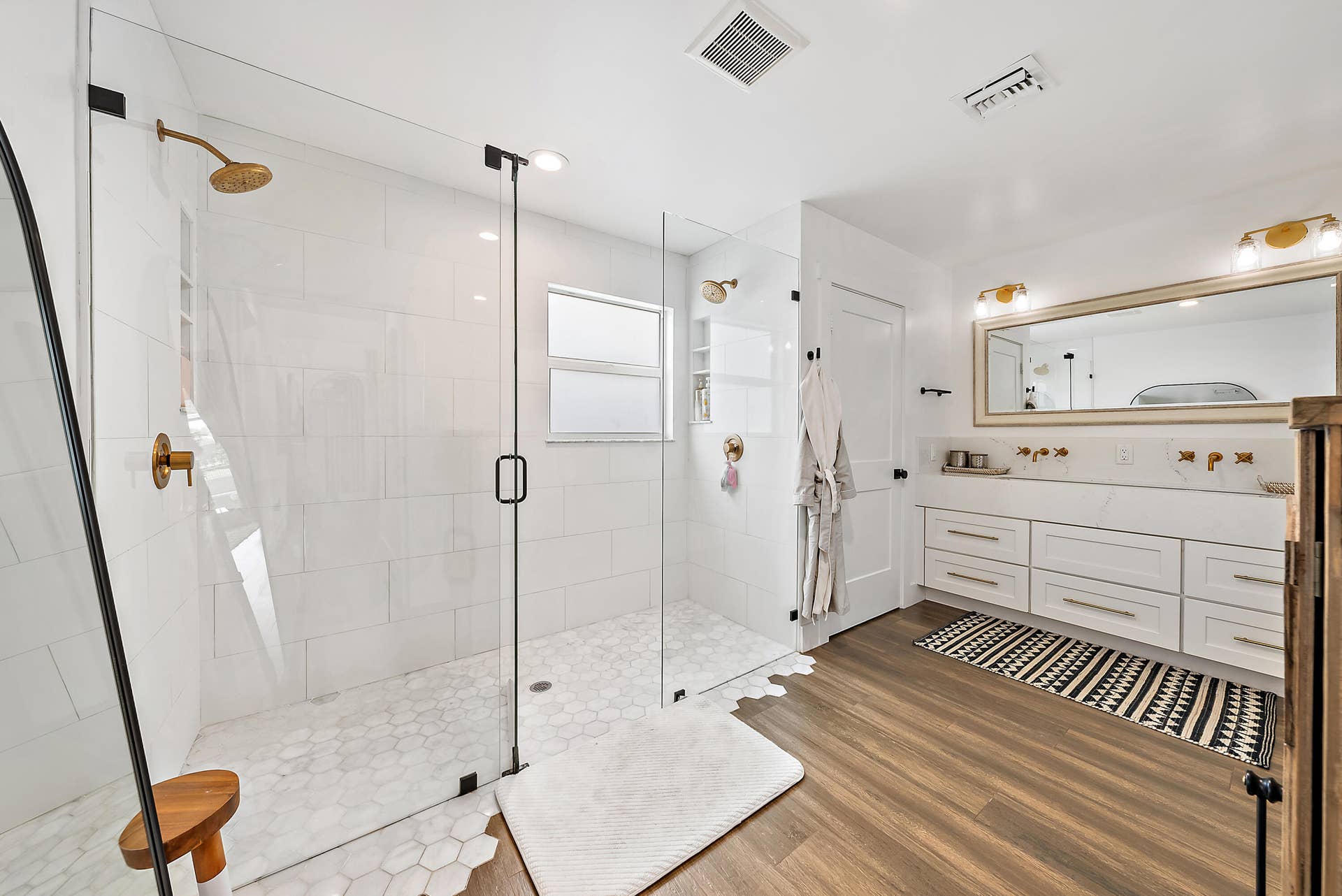 6204 SAND PINE Court, Jupiter, Jupiter, FL 33458 Glass-enclosed shower with gold-toned fixtures and hexagonal tile flooring