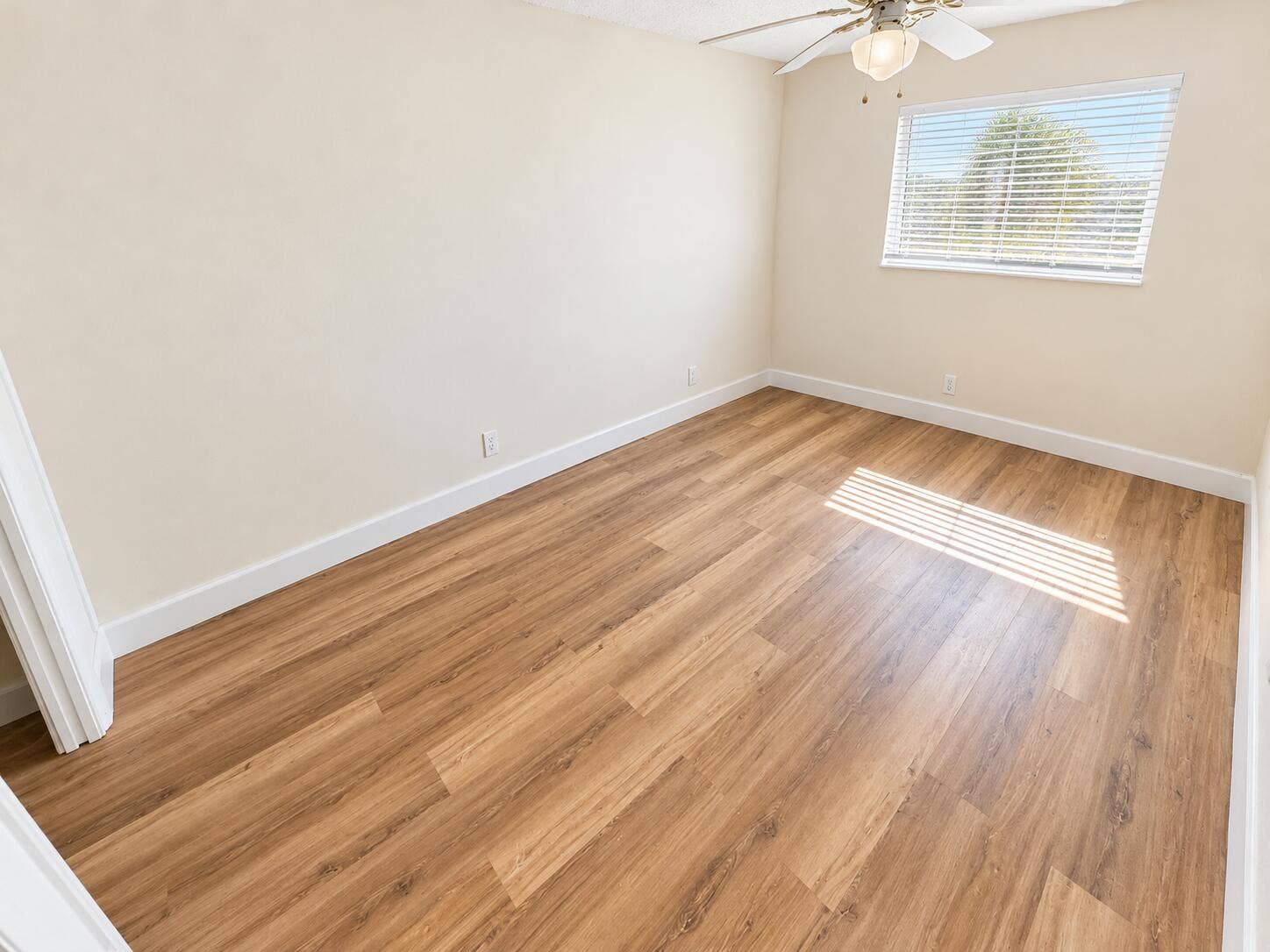 Boca Raton, Boca Raton, FL 33428 Bright Empty Bedroom with Wood Floors