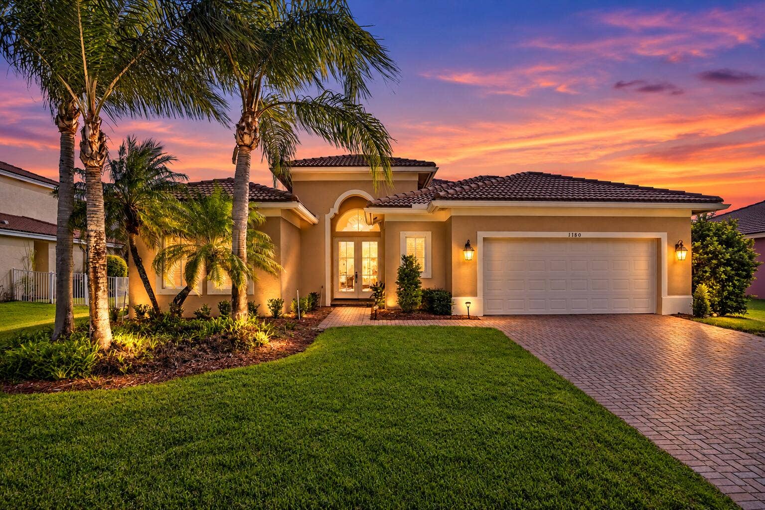 1180 AMETHYST Drive SW, Vero Beach, FL 32968 Twilight Mediterranean Home with Palms