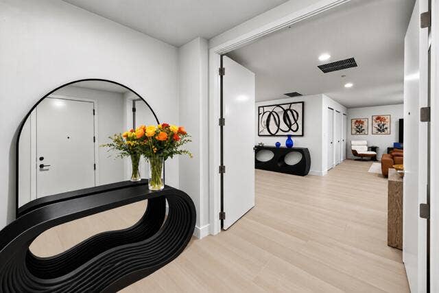 A grand entrance showcasing contemporary elegance, refined finishes, and a beautifully appointed foyer that creates an unforgettable first impression