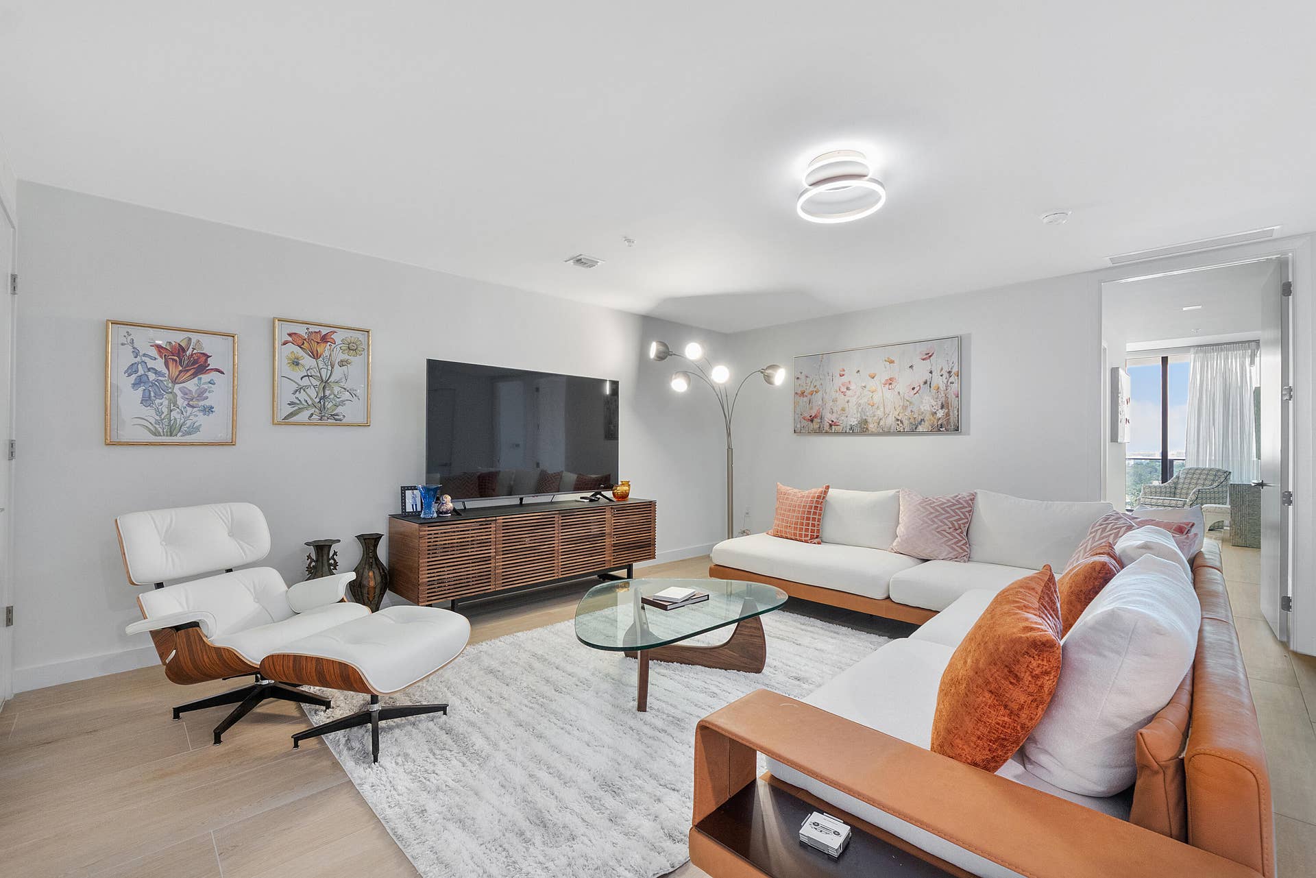 An inviting living area featuring elegant contemporary furnishings, abundant natural light, and a spacious layout designed for effortless entertaining and relaxation.