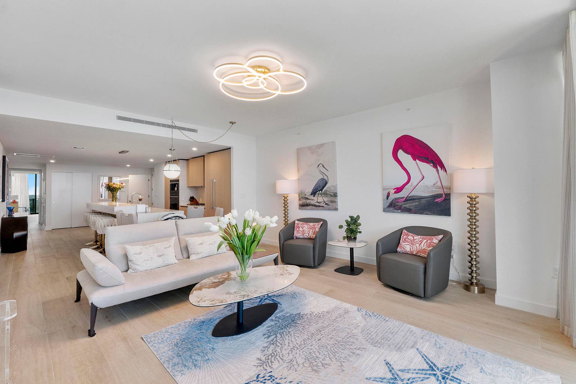 Experience refined coastal luxury in this beautifully appointed open-concept living space. Contemporary furnishings, elegant finishes, and a bright, airy atmosphere create the perfect setting for sophisticated entertaining or relaxing in comfort. A seamless blend of modern design and timeless elegance.