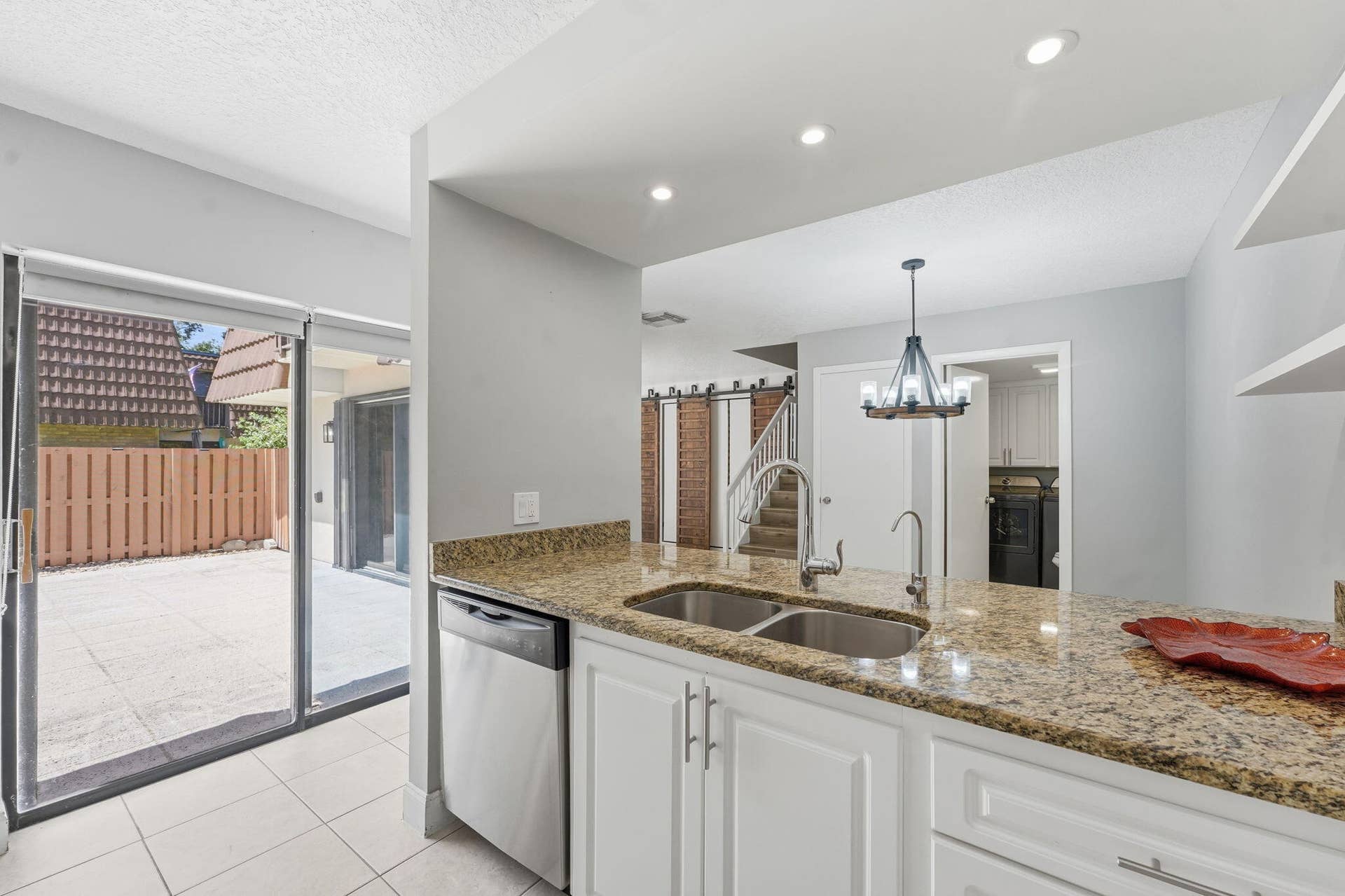 236 CHARTER Way, West Palm Beach, FL 33407 Kitchen featuring granite countertops, white cabinetry, stainless steel dishwasher, recessed lighting, and a dual basin sink