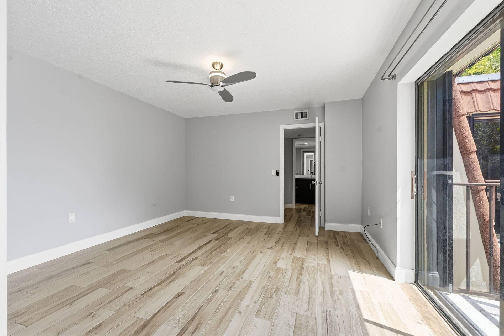 236 CHARTER Way, West Palm Beach, FL 33407 Light wood-finish flooring, neutral wall tones, and ceiling fan with integrated lighting