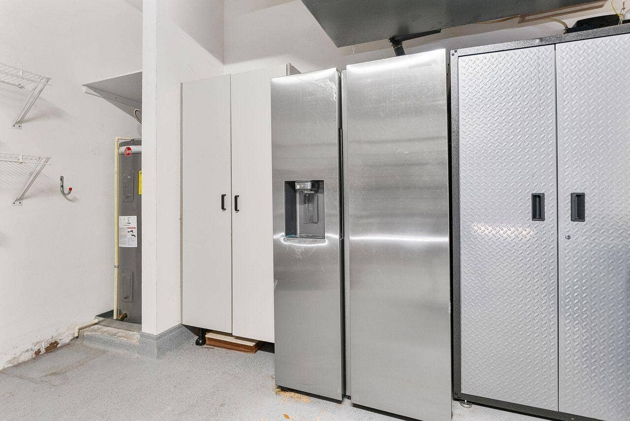 Newer stainless refrigerator in garage