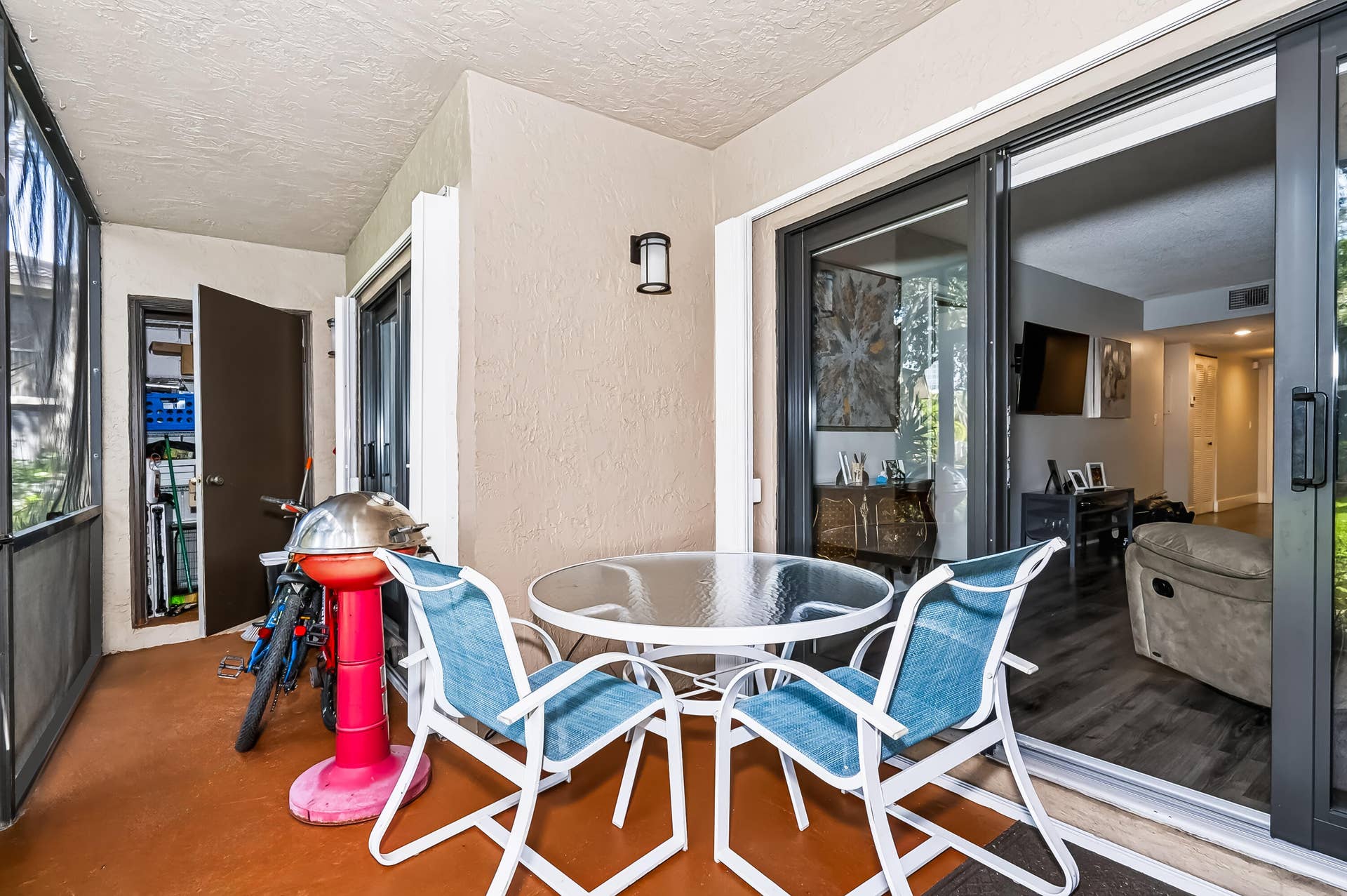 LARGE ENCLOSED PATIO WITH STORAGE ROOM
