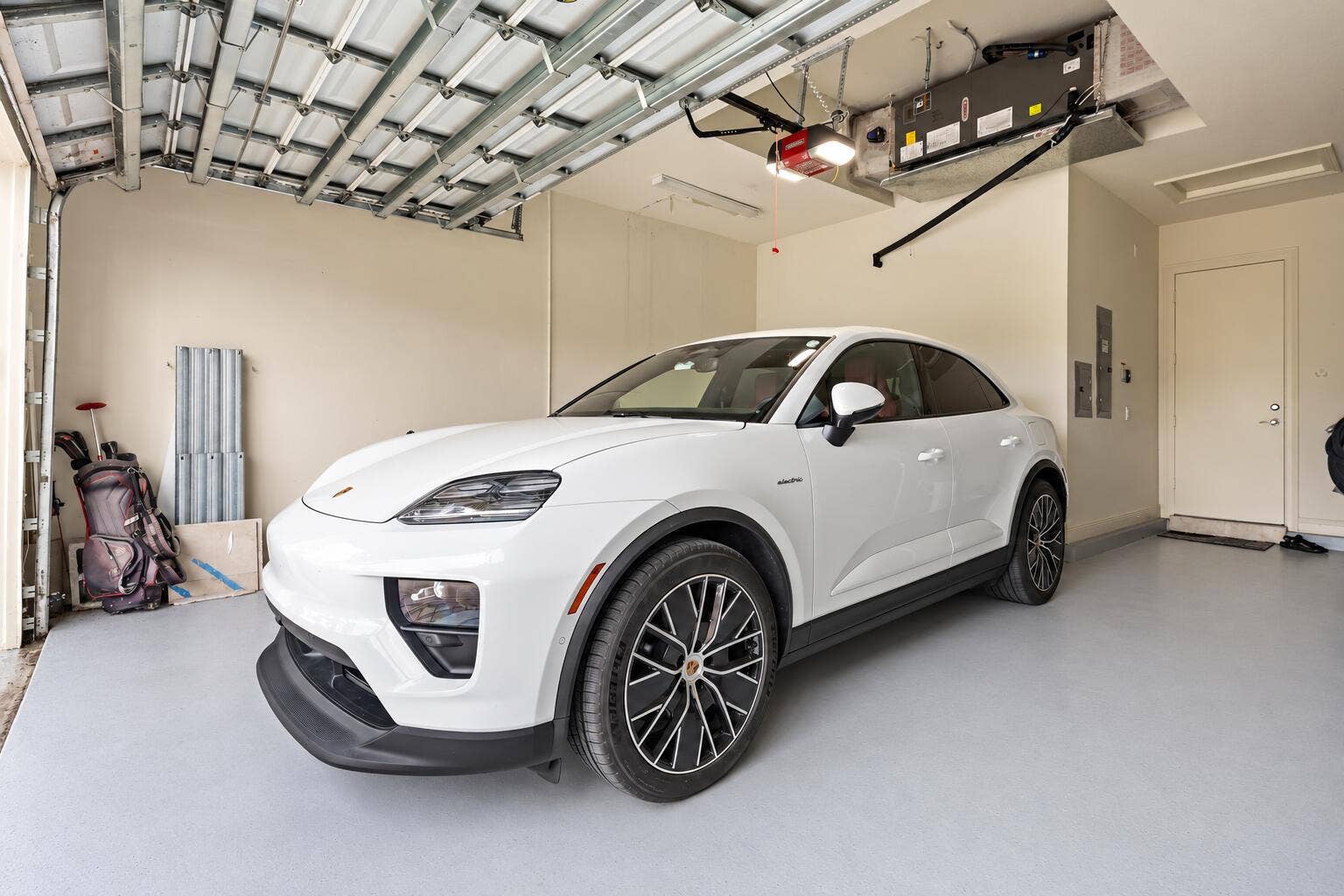 White Porsche on a clean gray floor