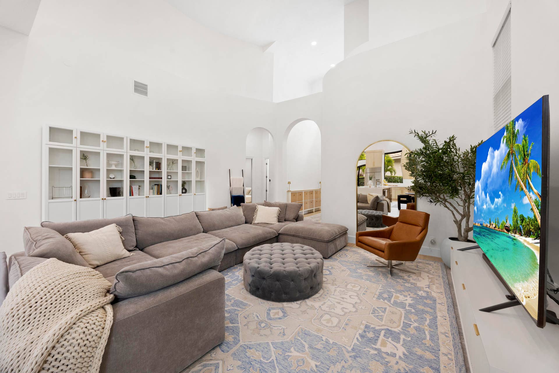 High ceilings, floor-to-ceiling built-in cabinetry, and distinctive arched architectural details