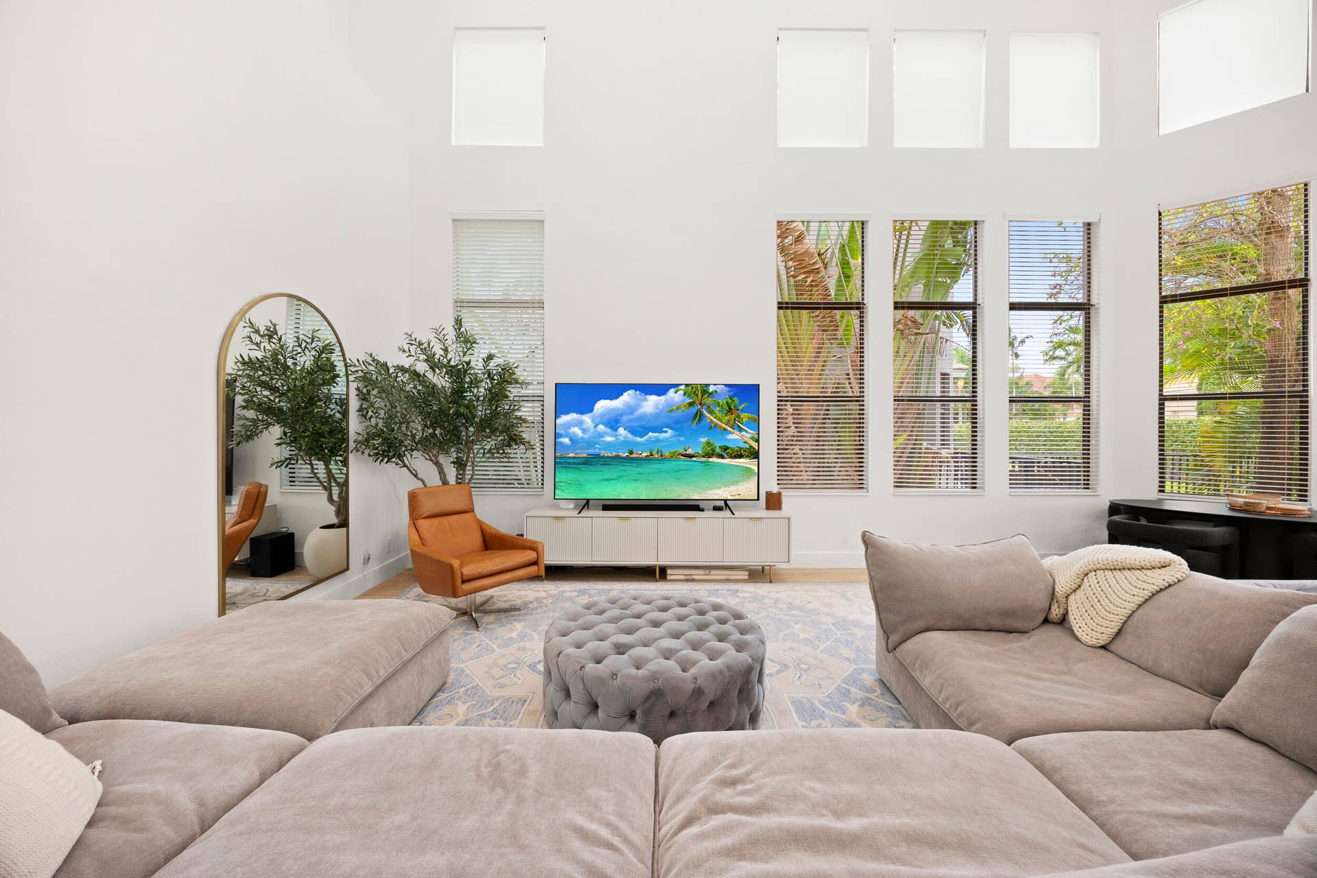 Double-height ceilings featuring floor-to-ceiling windows and clerestory windows
