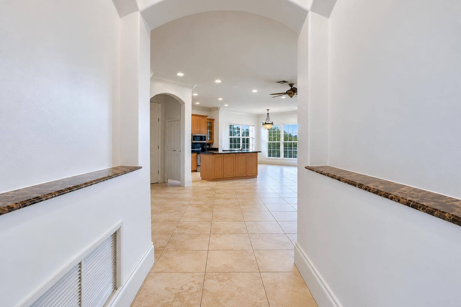 Symmetrical Modern Foyer and Open Kitche