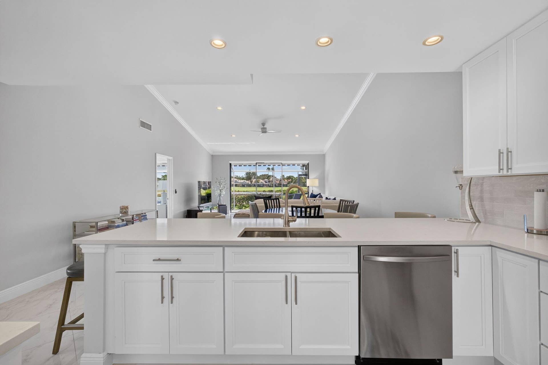 543 Prestwick Circle, Palm Beach Gardens, FL 33418 Kitchen featuring white cabinetry, quartz countertops, dual-basin stainless steel sink, stainless steel dishwasher, and recessed ceiling lighting