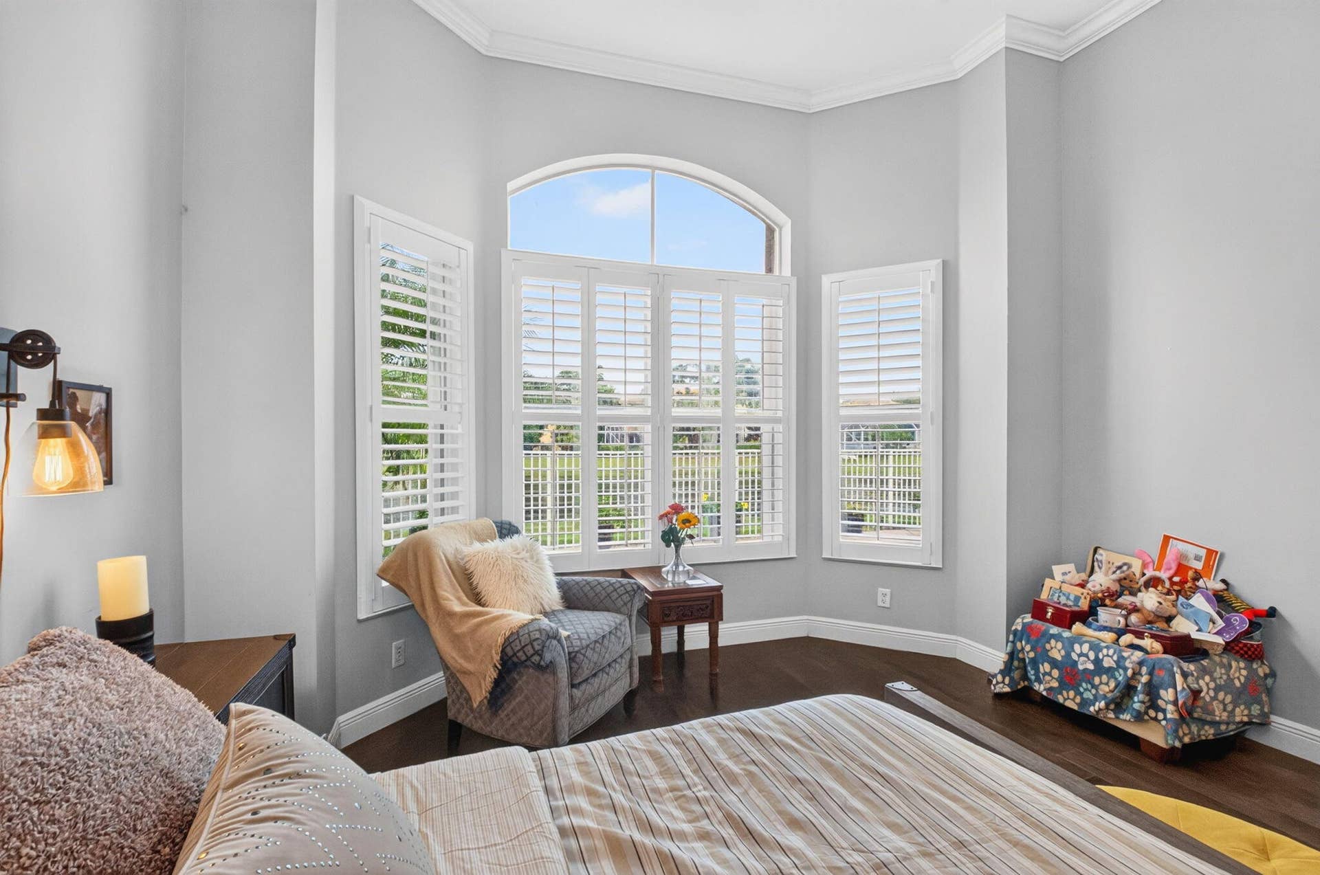 Bay window, plantation shutters, tray ceiling and crown molding