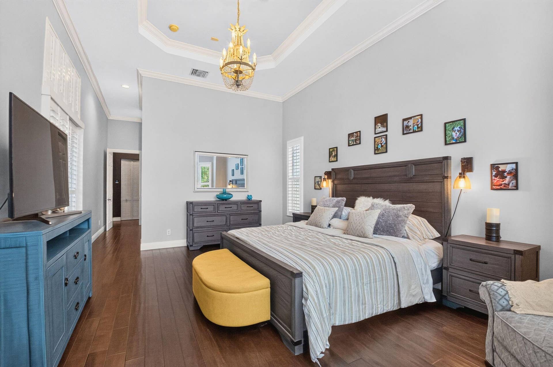 Bay window, plantation shutters, tray ceiling and crown molding